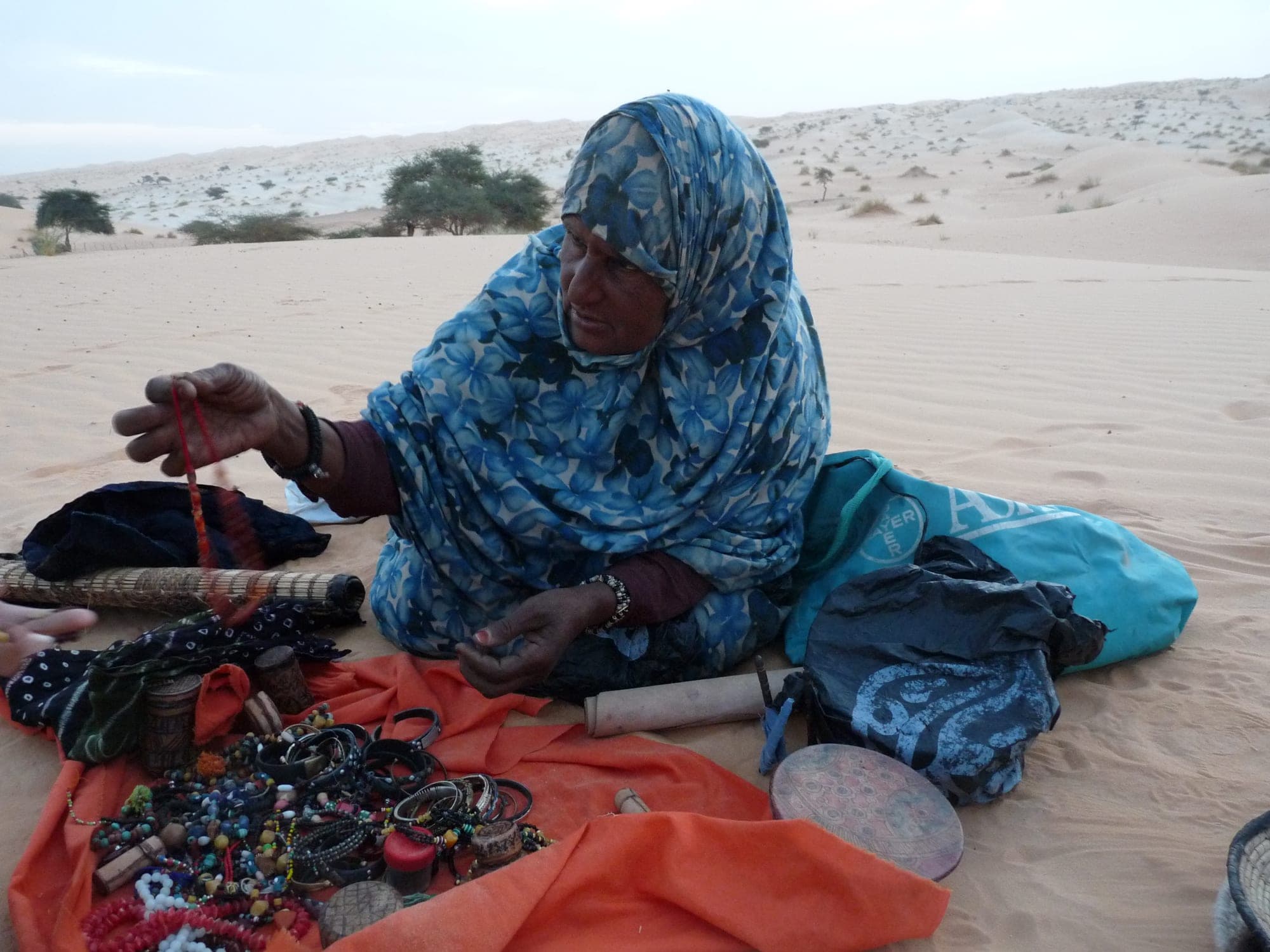 Nomadic woman presenting handicrafts in the Adrar
