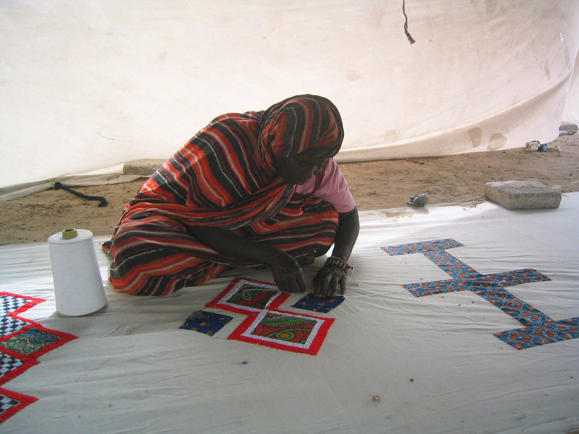 Woman sewing a khaïma at the Nouakchott tent market