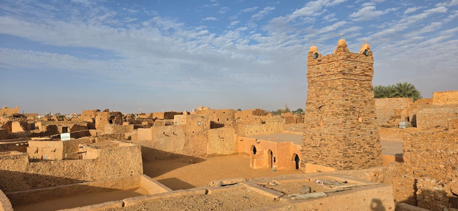 Historic stone buildings beneath the blue sky in Chinguetti